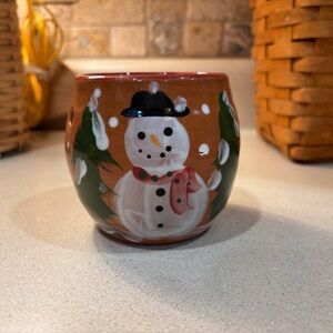 Hand-painted ceramic snowman candle holder.